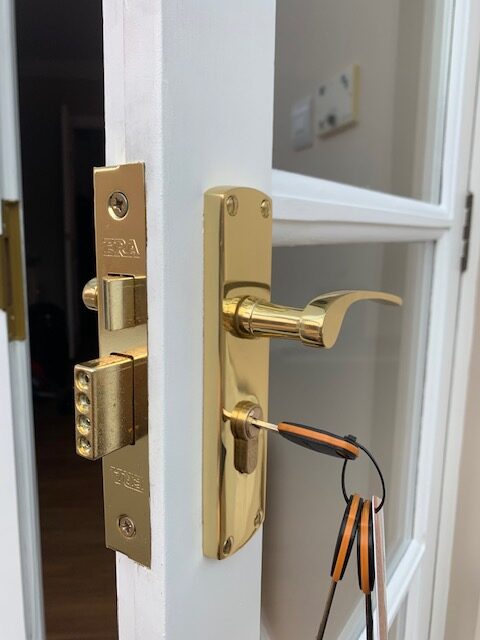 “Professional locksmith repairing a door lock in Stonesfield Oxfordshire”