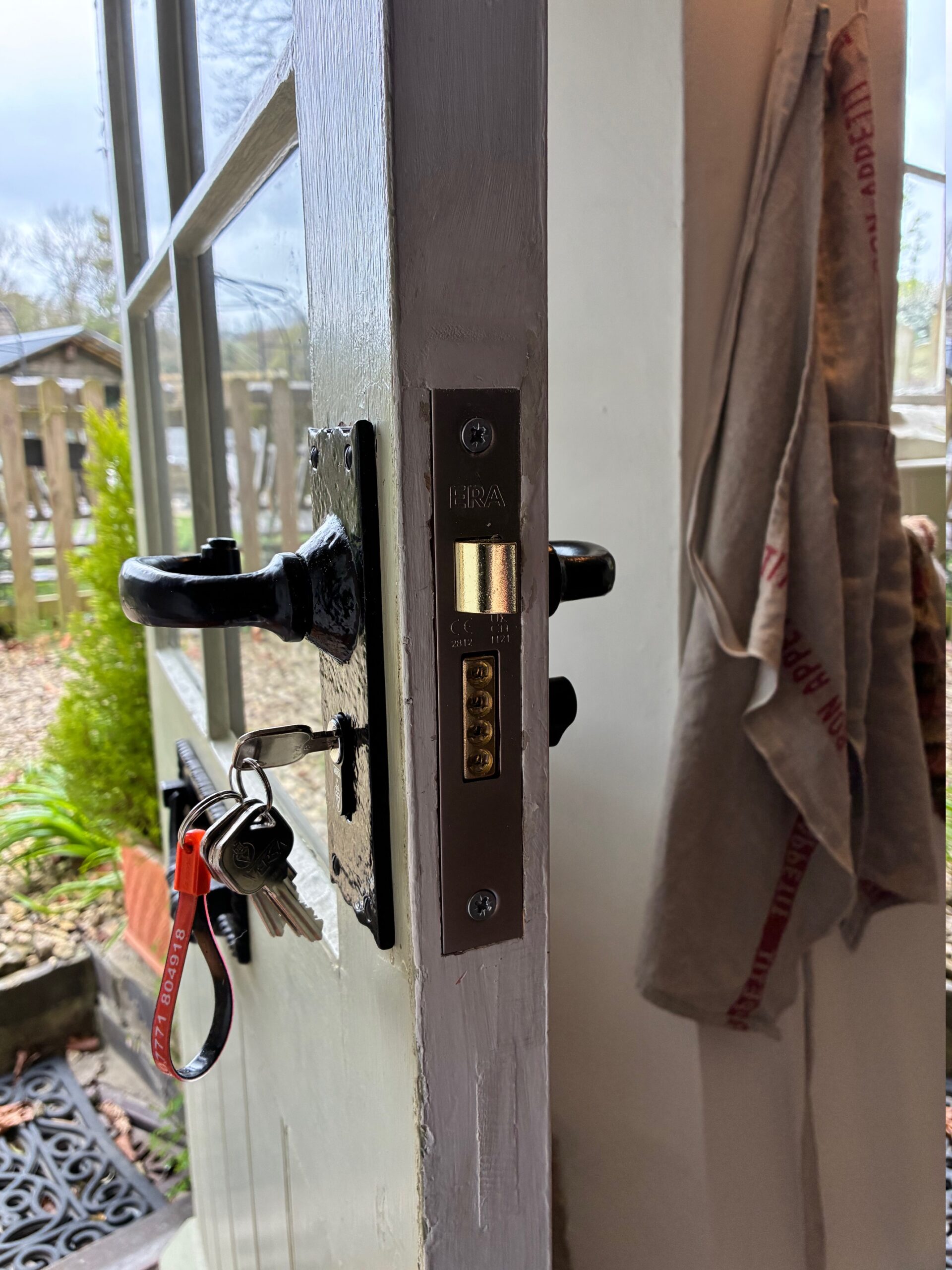Professional locksmith from Blockley Locksmiths installing a door lock