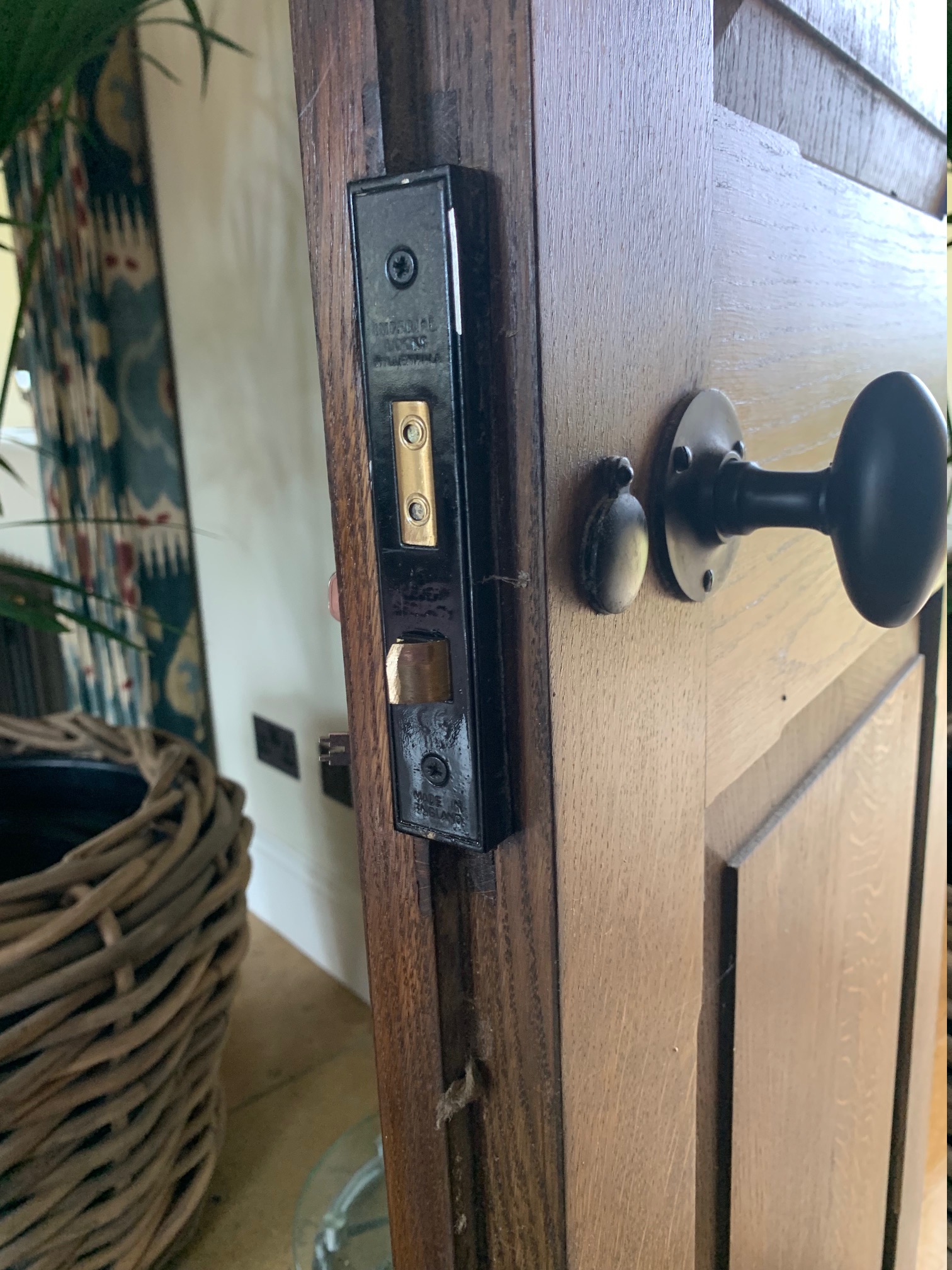 “Locksmith in Chipping Campden repairing a traditional wooden door lock”