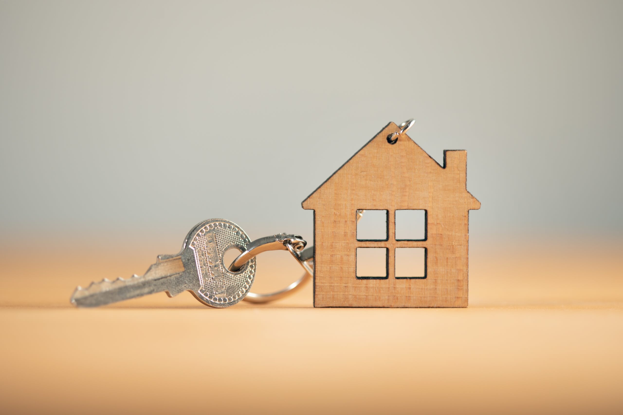 A professional locksmith handing over a new set of high-security keys to a homeowner in Oxfordshire.