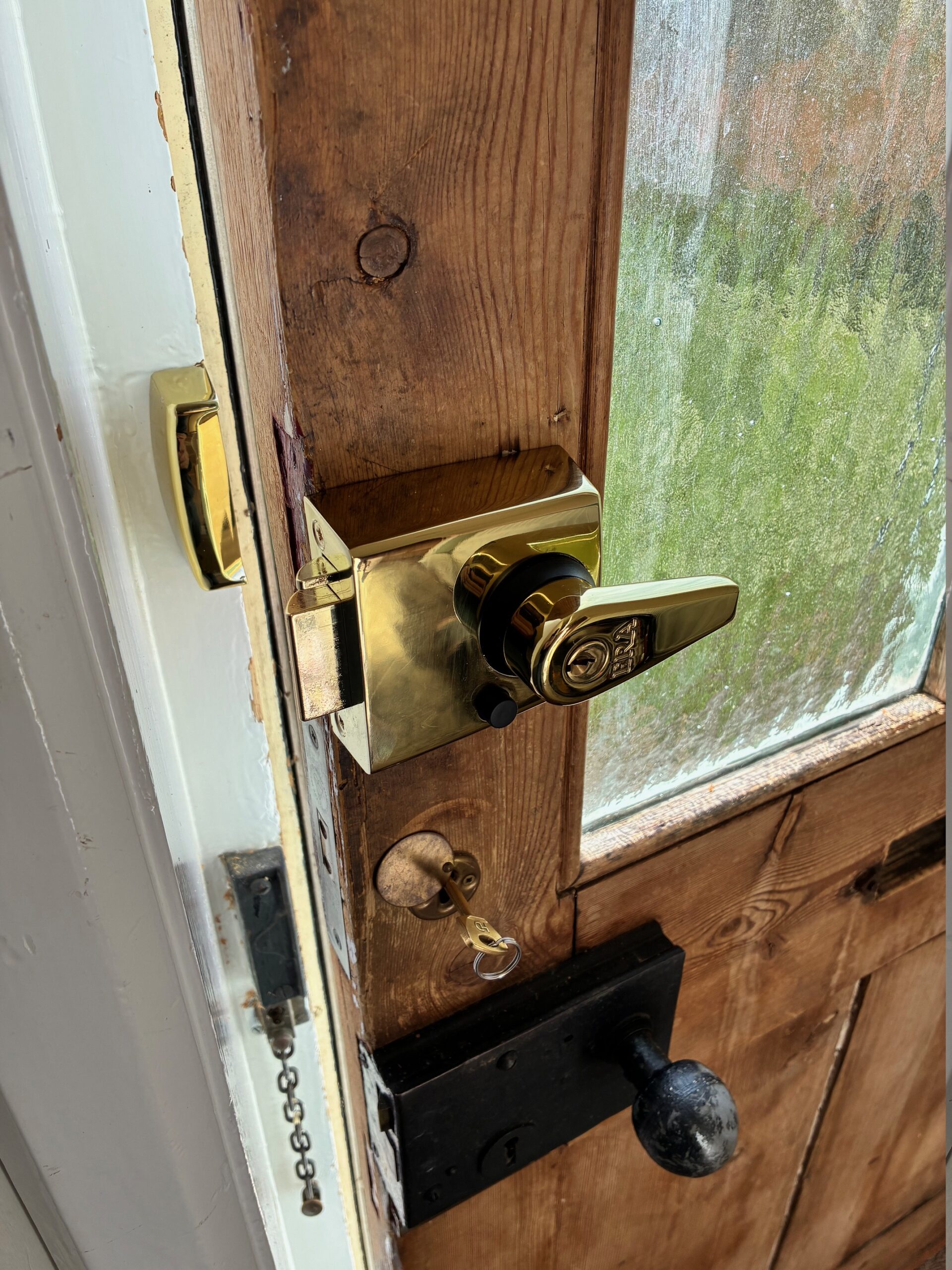 “Finstock Locksmiths technician unlocking a residential door with professional tools”