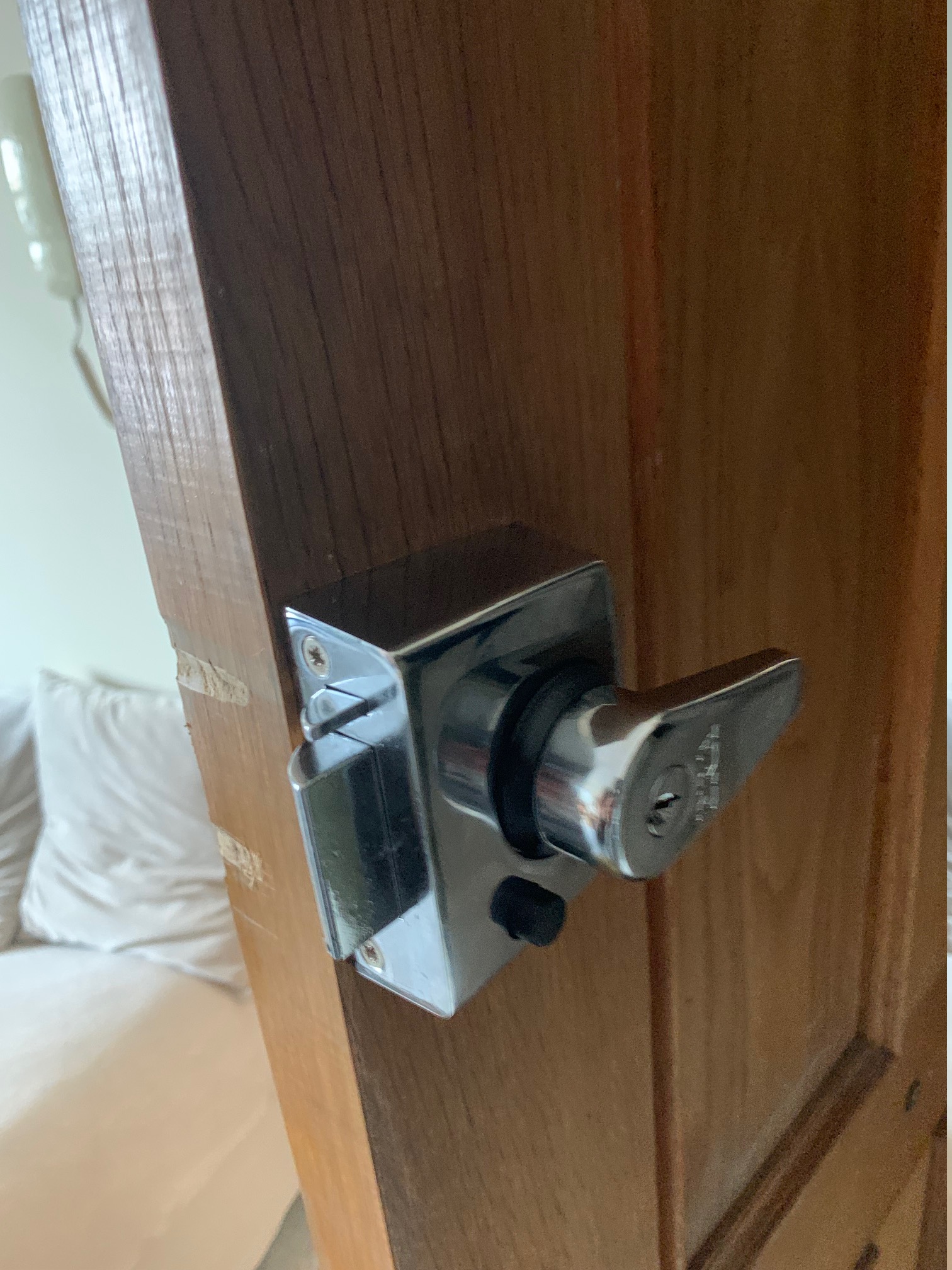 Locksmith from North Leigh Locksmiths fixing a residential door lock